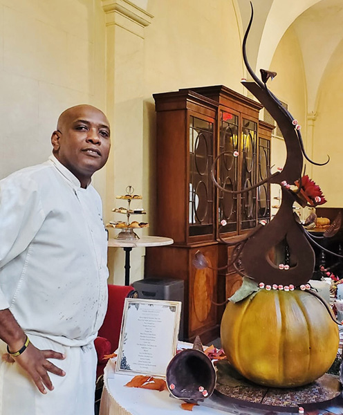 Photo of Pastry Chef Anthony Smith with the Thanksgiving Chocolate Showpiece 2023