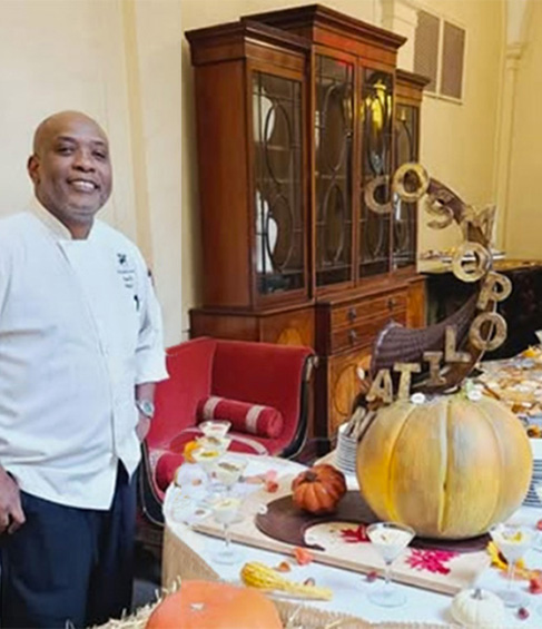 Photo of Pastry Chef Anthony Smith with the Thanksgiving Chocolate Showpiece 2024