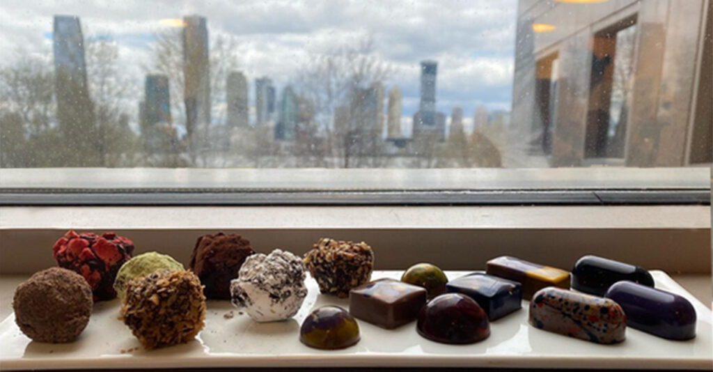 Pastry Chef Anthony Smith Chocolate Bon Bons made by students at ICE photo with NYC skyline