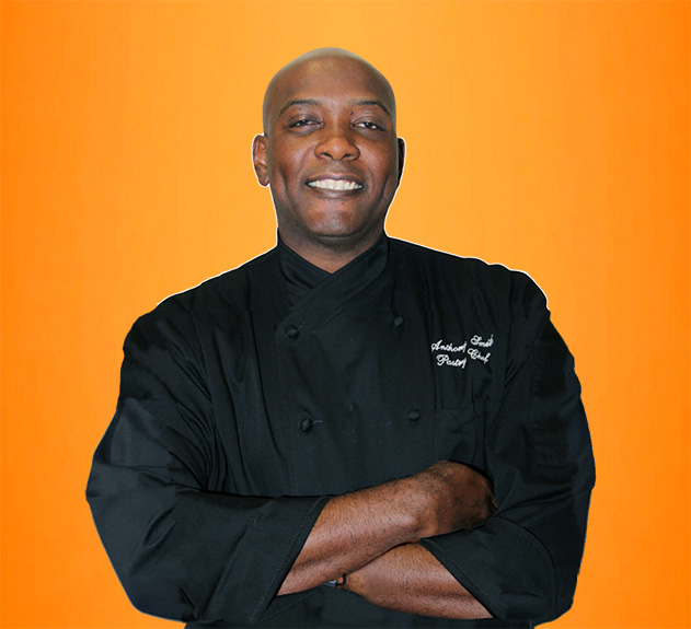 Executive Pastry Chef Anthony Smith wears his black chefs jacket